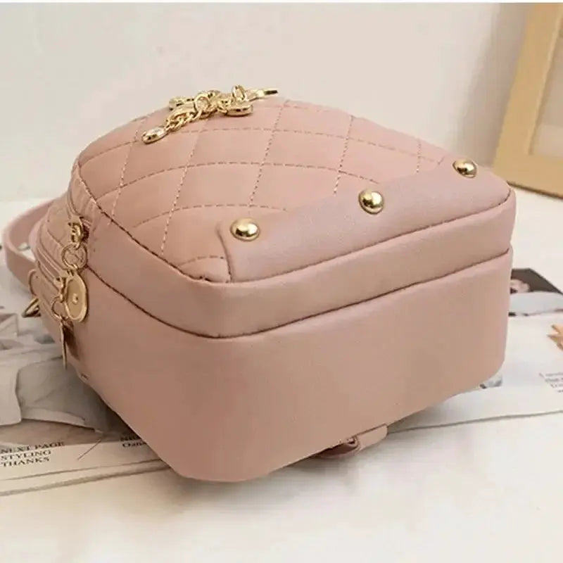 Fashion women's mini backpack by Simples Market; pink quilted leisure-style handbag with gold hardware.