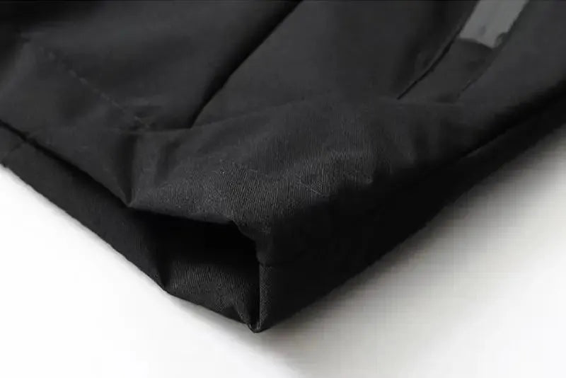 Men's waterproof rain jacket; black lightweight hooded outerwear close-up
