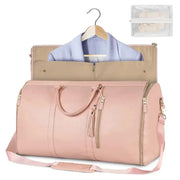 Foldable pink PU leather travel duffel bag with top zip, detachable strap, interior organizer, and mesh pouch.