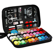 Sewing kit box with numerous multicolored thread spools and assorted hand sewing tools in a black case