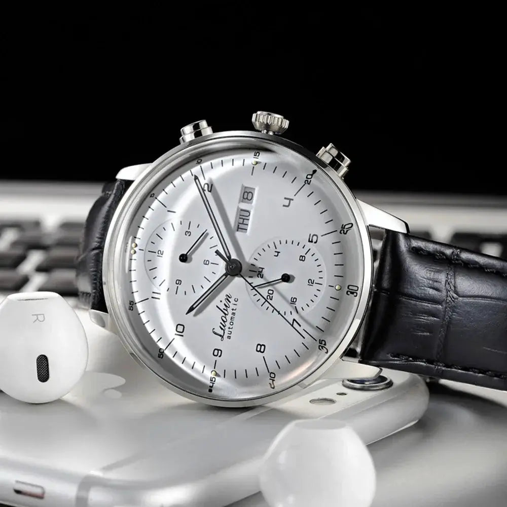 Men's silver stainless steel automatic wristwatch with black leather strap and two subdials