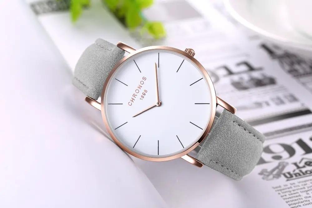 CHRONOS unisex watch with white dial, rose-gold case and gray suede strap.