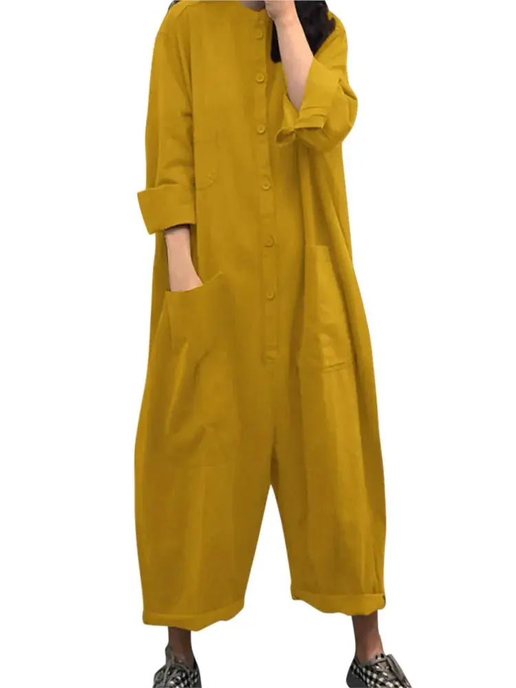Womens mustard yellow loose jumpsuit with large pockets, button front, long sleeves, rolled cuffs, ankle-length wide-leg