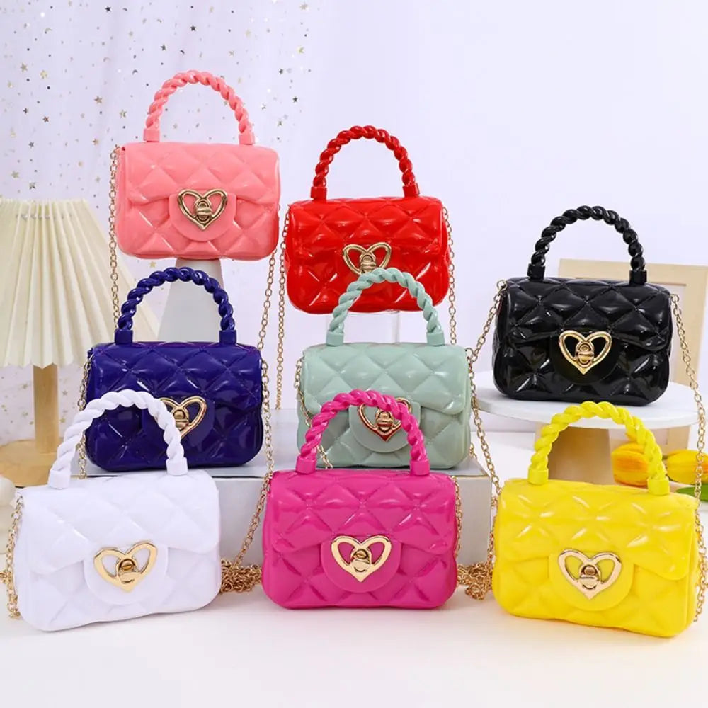 Kids PU leather crossbody bags set of 8 in pink, red, black, purple, white, mint, magenta, yellow with quilted hearts and a gold heart clasp