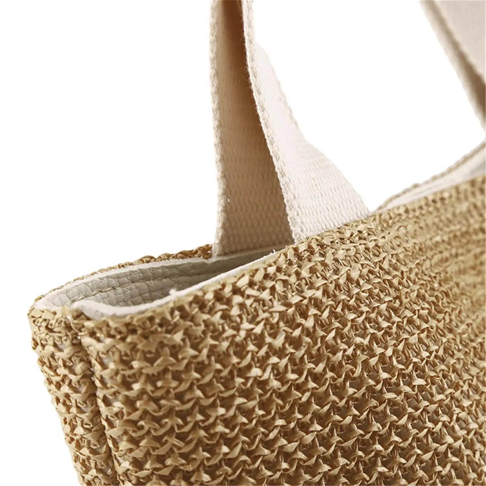 Natural straw woven tote bag with beige handles and top-handle design