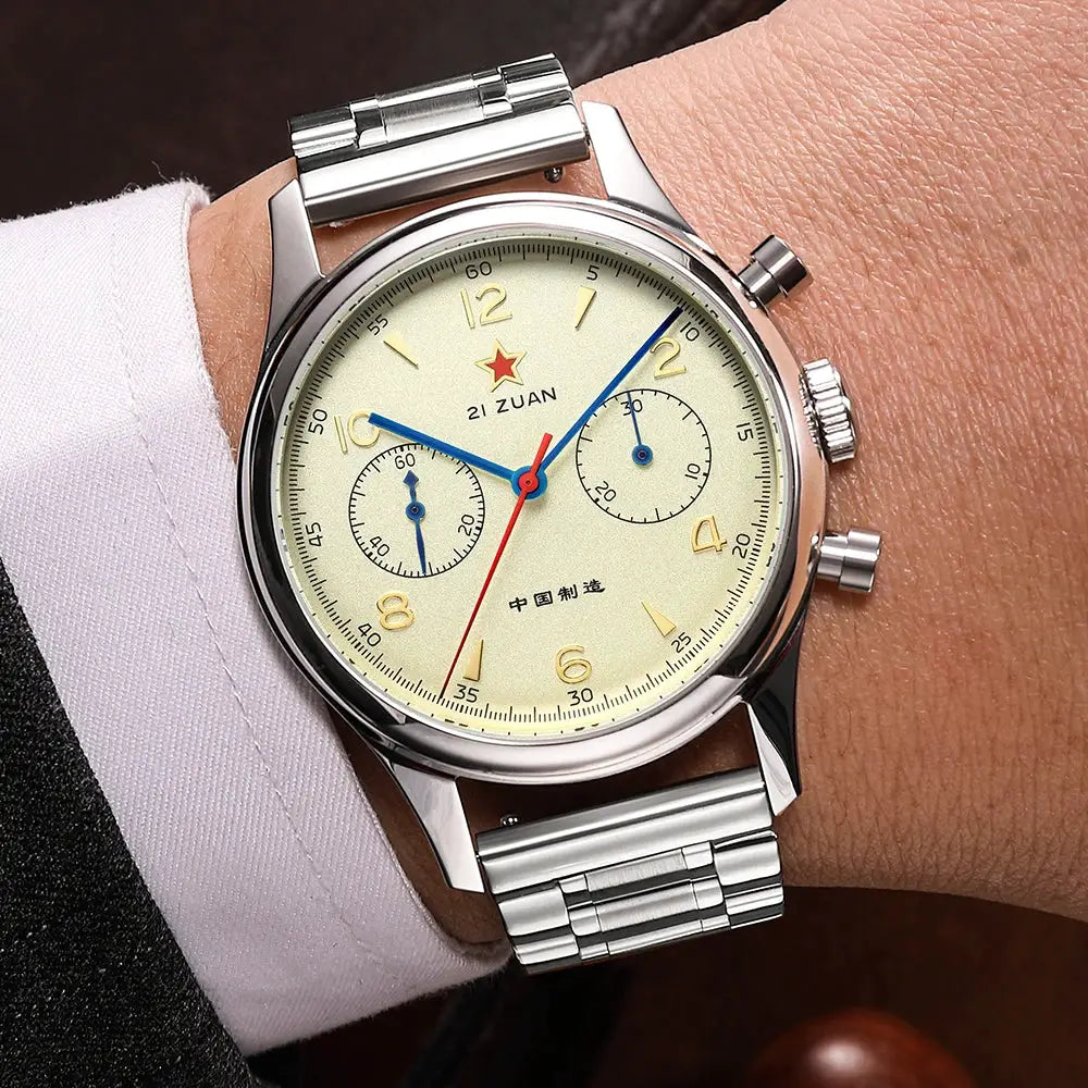 Red Star 38mm men's chronograph watch with cream dial, blue hands, red seconds hand, and stainless steel bracelet.