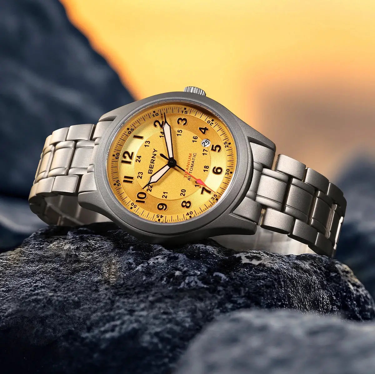 BERNY automatic titanium men's watch with gold dial, date window, and titanium bracelet