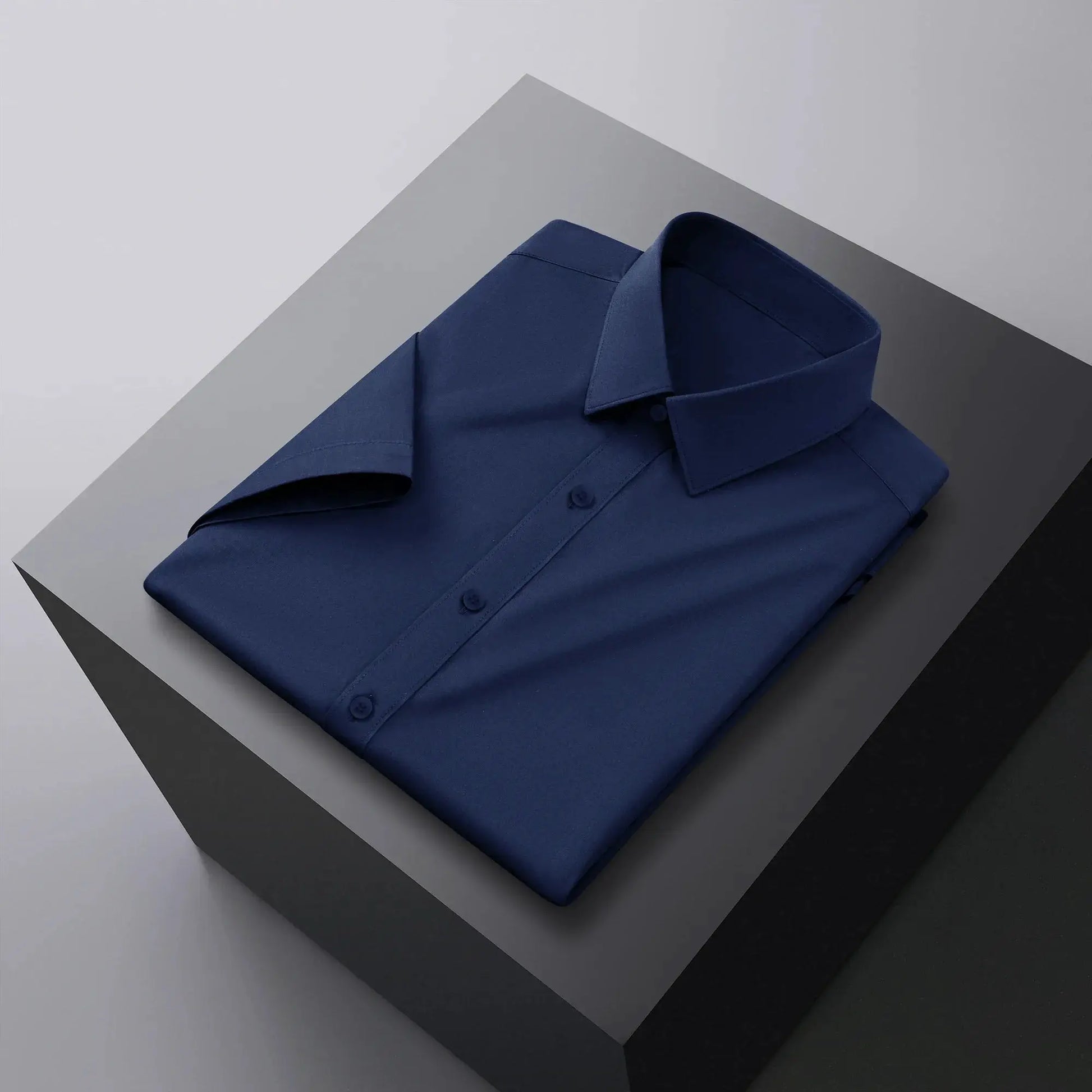 Men's navy blue solid-color short-sleeve shirt for business casual.