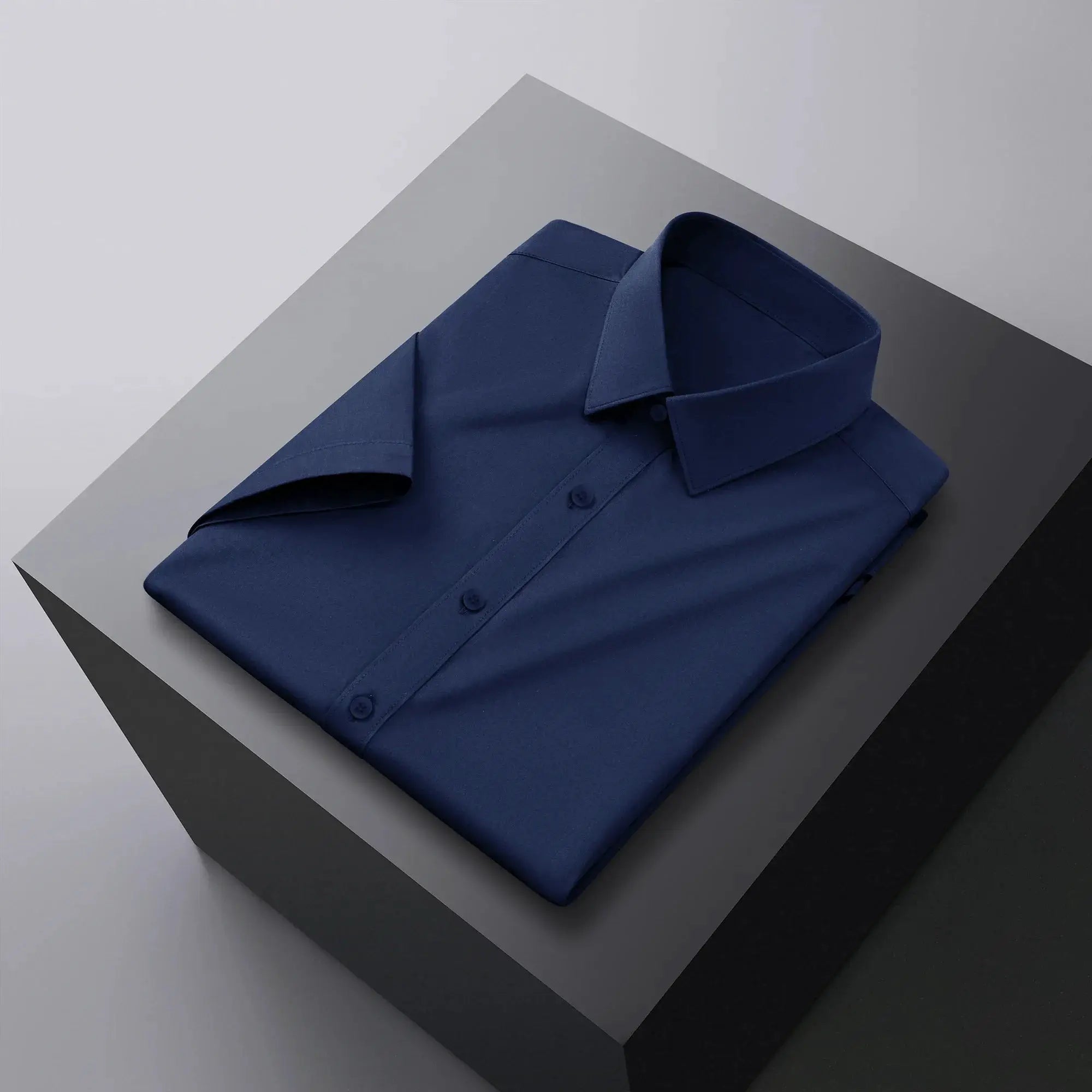 Men's navy blue solid-color short-sleeve shirt for business casual.