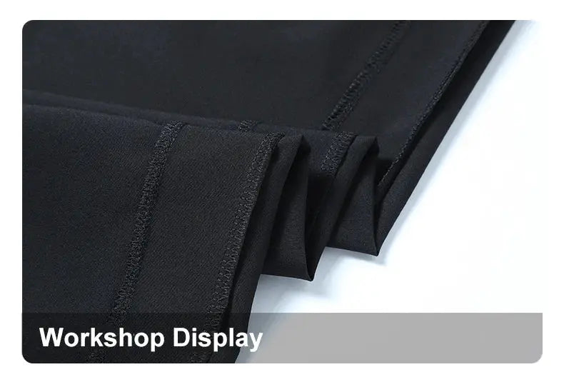 Running pants in black with soft stretch fabric and visible hem stitching.