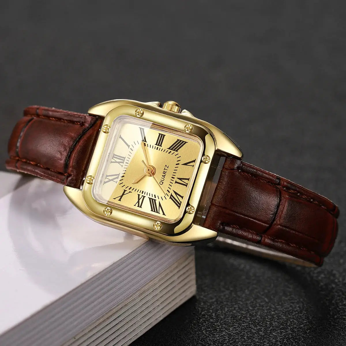 Women's square leather strap quartz watch by Simples Market, gold-tone case, Roman numerals.