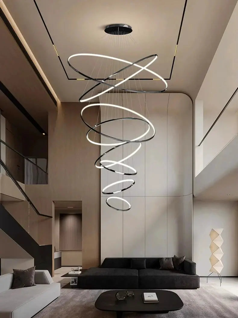 LED pendant chandelier by Simples Market with looping silver rings for a modern living room.