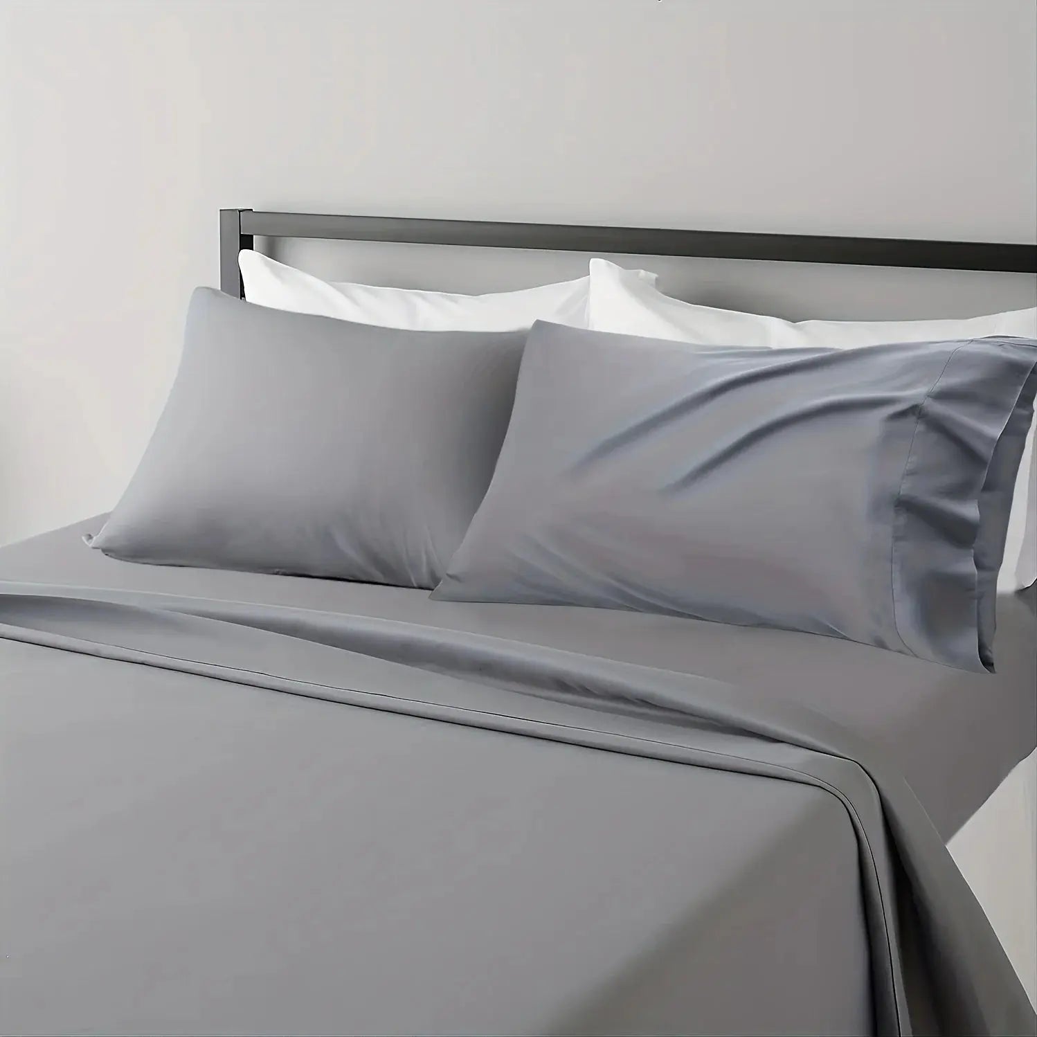 Sheet set breathable cooling gray bed sheets with 2 gray pillowcases on a bed