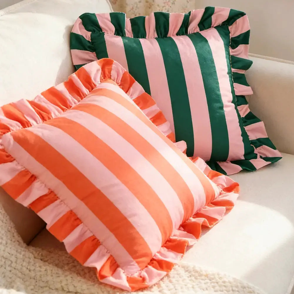 Two striped velvet pillowcases, 18x18, with ruffled edges in pink-orange and green-pink.