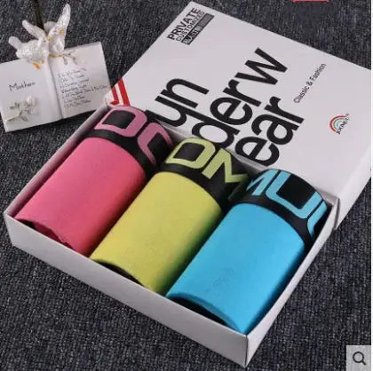 Simples Market 3-pack women's cotton boyshorts in pink, yellow, and blue with bold black-letter waistbands