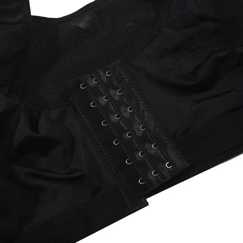 Post-surgery compression bra in black with side hook-and-eye closures for implant stabilization