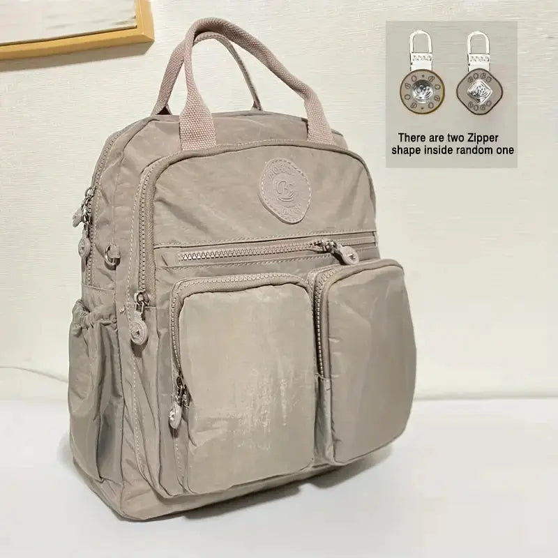 Backpack by Simples Market: beige waterproof nylon with soft handles and multiple pockets