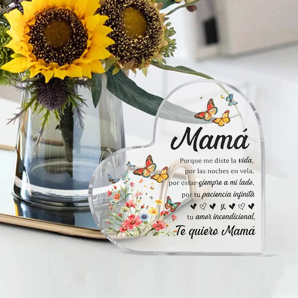 Heart-shaped clear acrylic ornament for Mom with flowers and butterflies and Te quiero Mamá message