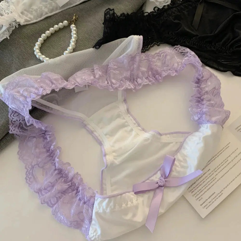 White satin panties with lavender lace ruffle trim and bow