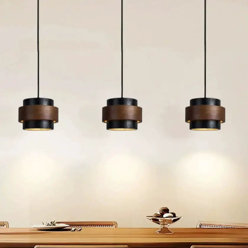 Bar pendant lamps trio in black with brown wood bands over dining table