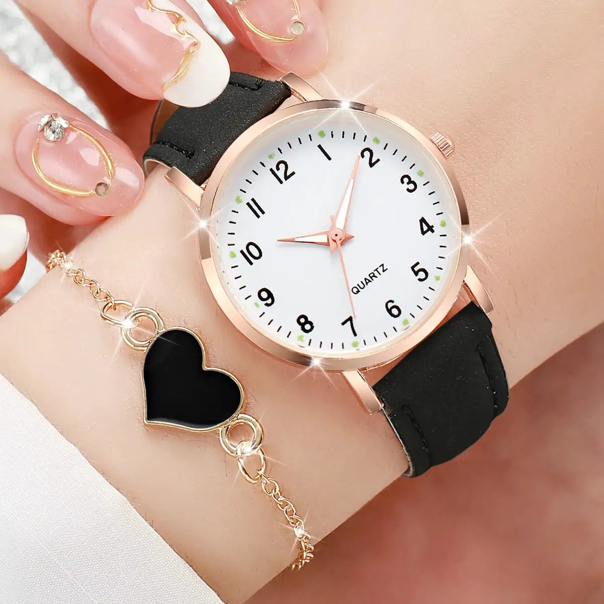 Women's rose-gold quartz watch with black leather strap and white Arabic dial, 2-piece watch and heart bracelet set