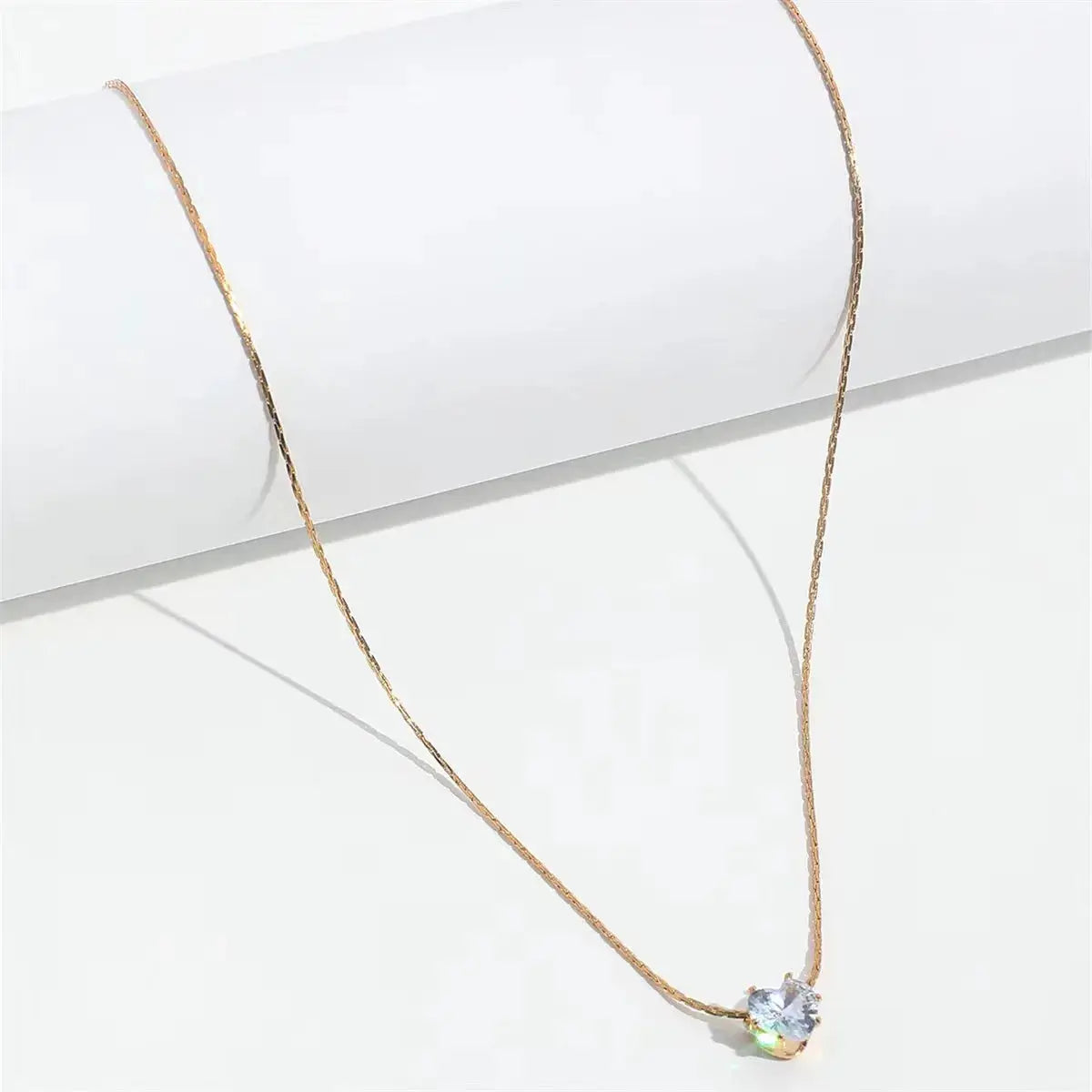 PerisBox dainty minimalist necklace with a round clear CZ stone on an anti-tarnish rose-gold stainless steel chain