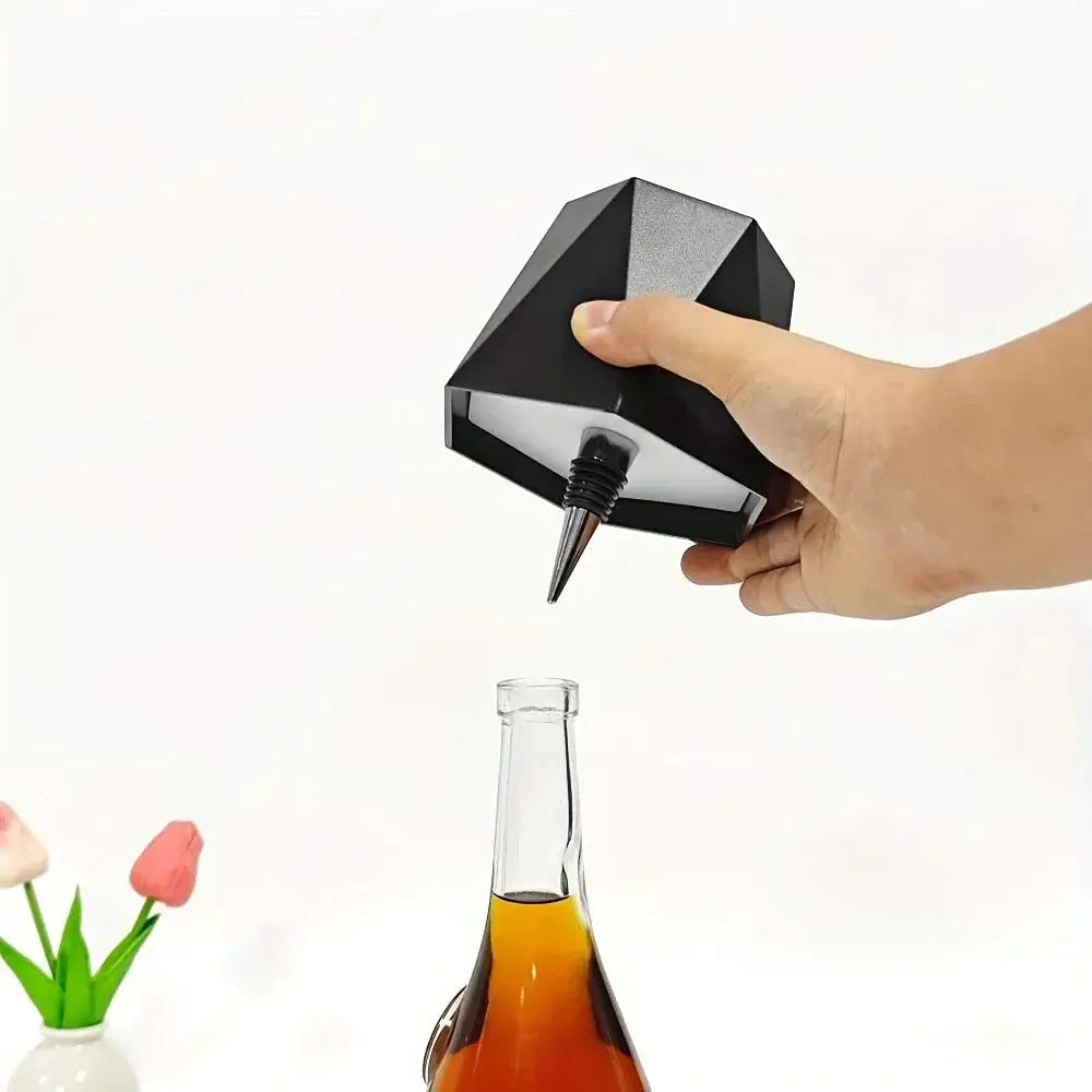 LED wireless wine bottle lamp by Simples Market; black faceted geometric design with touch control.