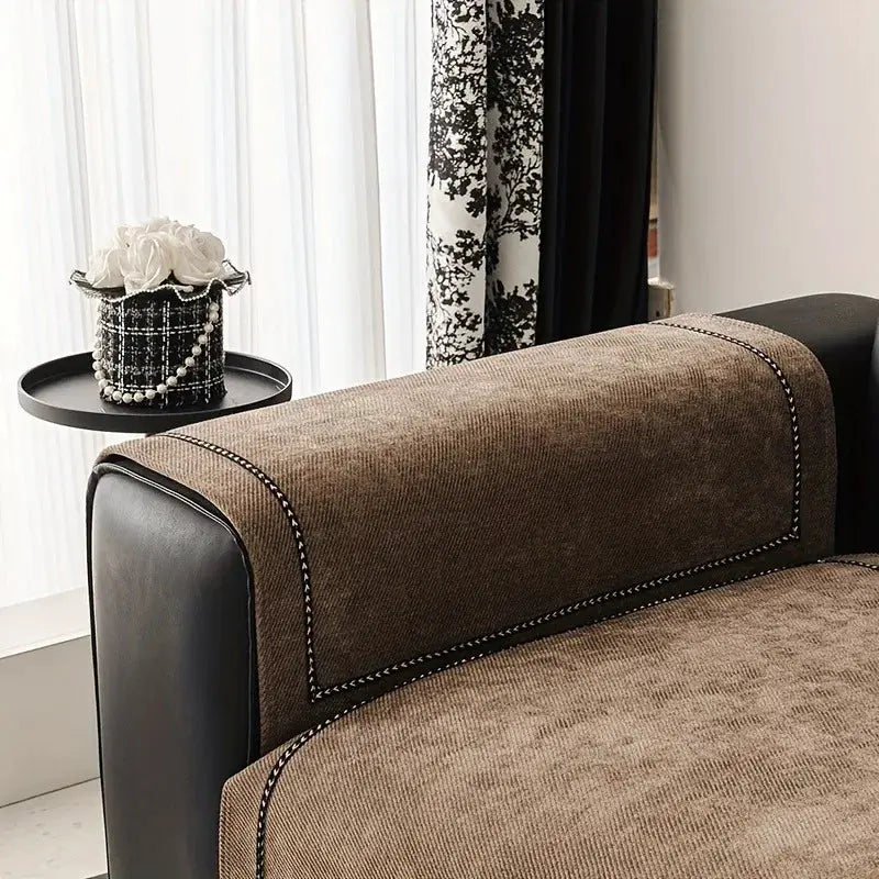 Vintage-style brown chenille sofa slipcover with white stitch trim; universal, non-slip, pet-friendly.