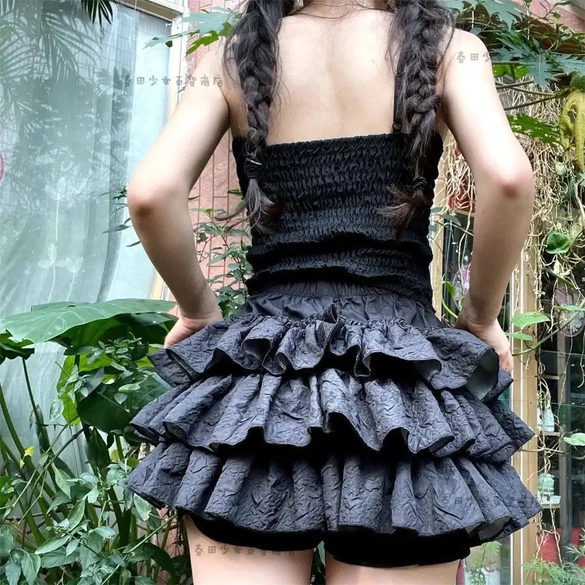 Kawaii ball gown mini skirt by Simples Market; black layered ruffle design with elastic high waist, back view.