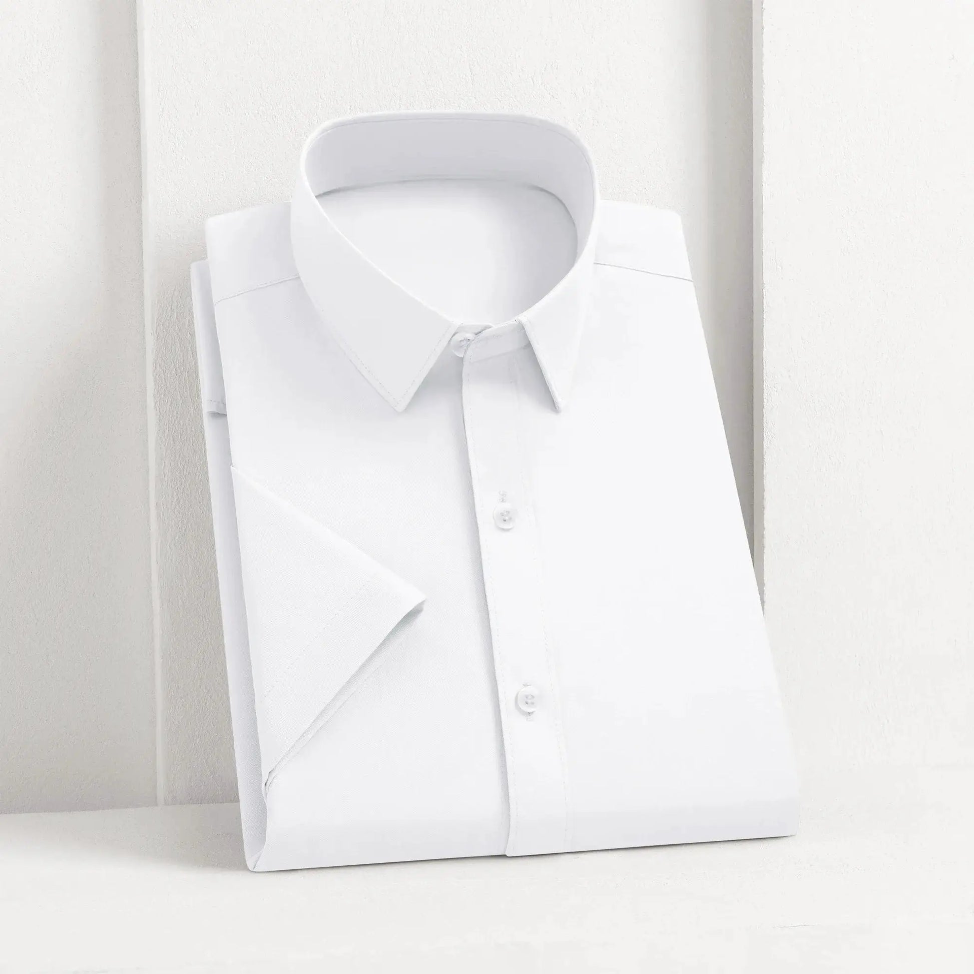 White men's dress shirt, solid color, button-front, neatly folded