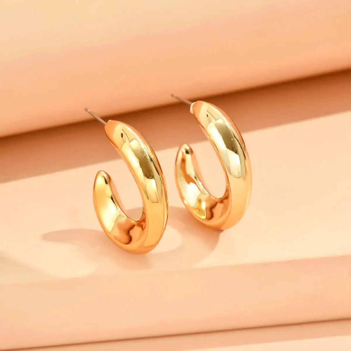 Gold-tone curved hoop earrings with geometric shape, minimalist women's jewelry, 2-piece set