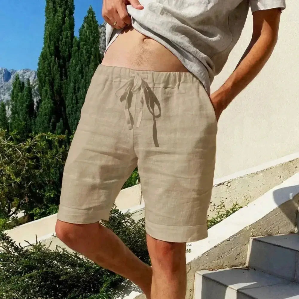 Men's knee-length cotton-linen shorts by Simples Market, beige breathable fabric with drawstring waist.