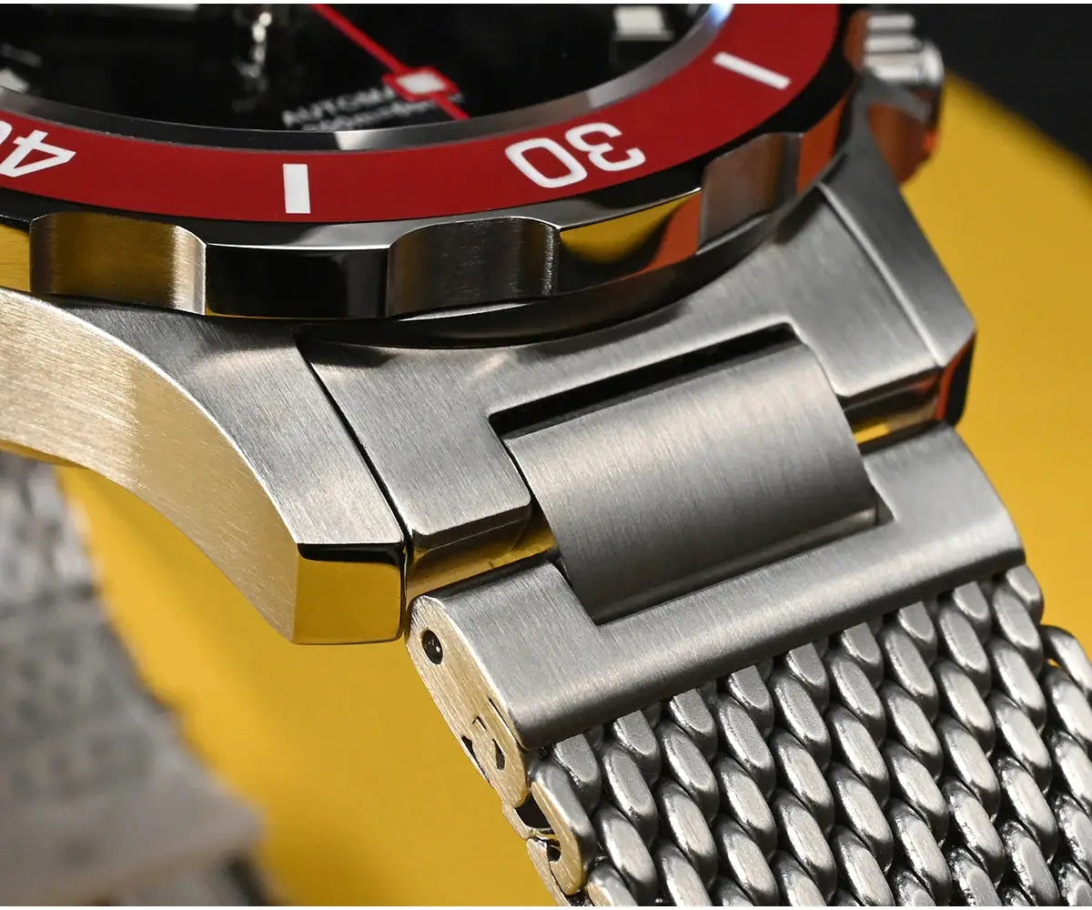 San Martin diver watch with red bezel and brushed stainless steel Milanese bracelet