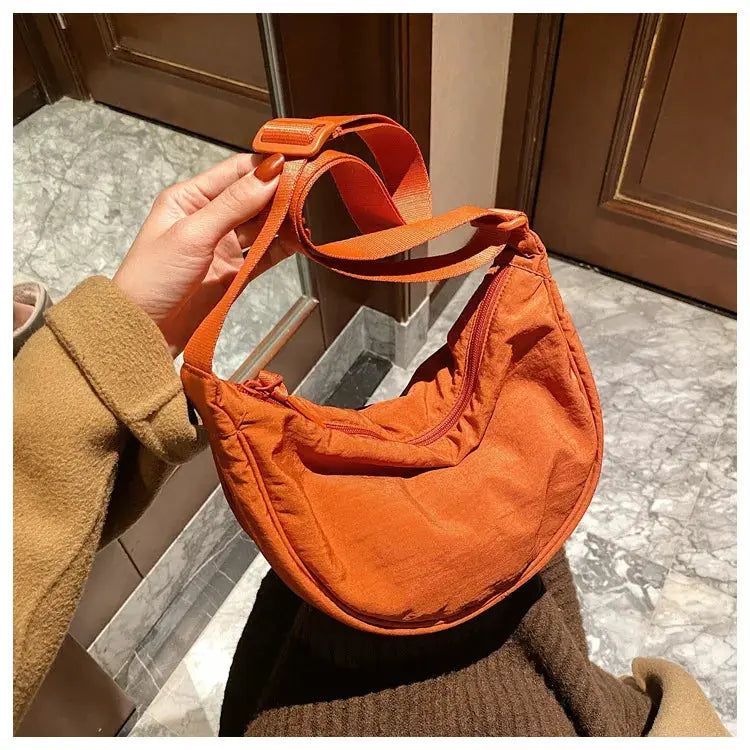 Casual nylon hobo crossbody bag for women in orange, large-capacity tote with adjustable strap