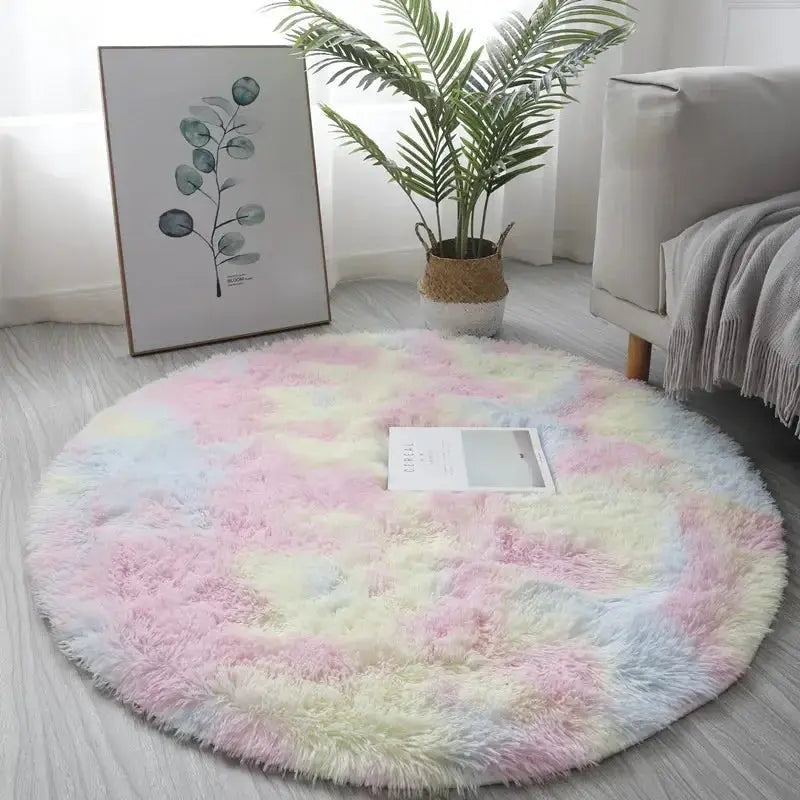Round plush rug with pastel pink, blue, yellow and white hues; fluffy thick pile for living room decor
