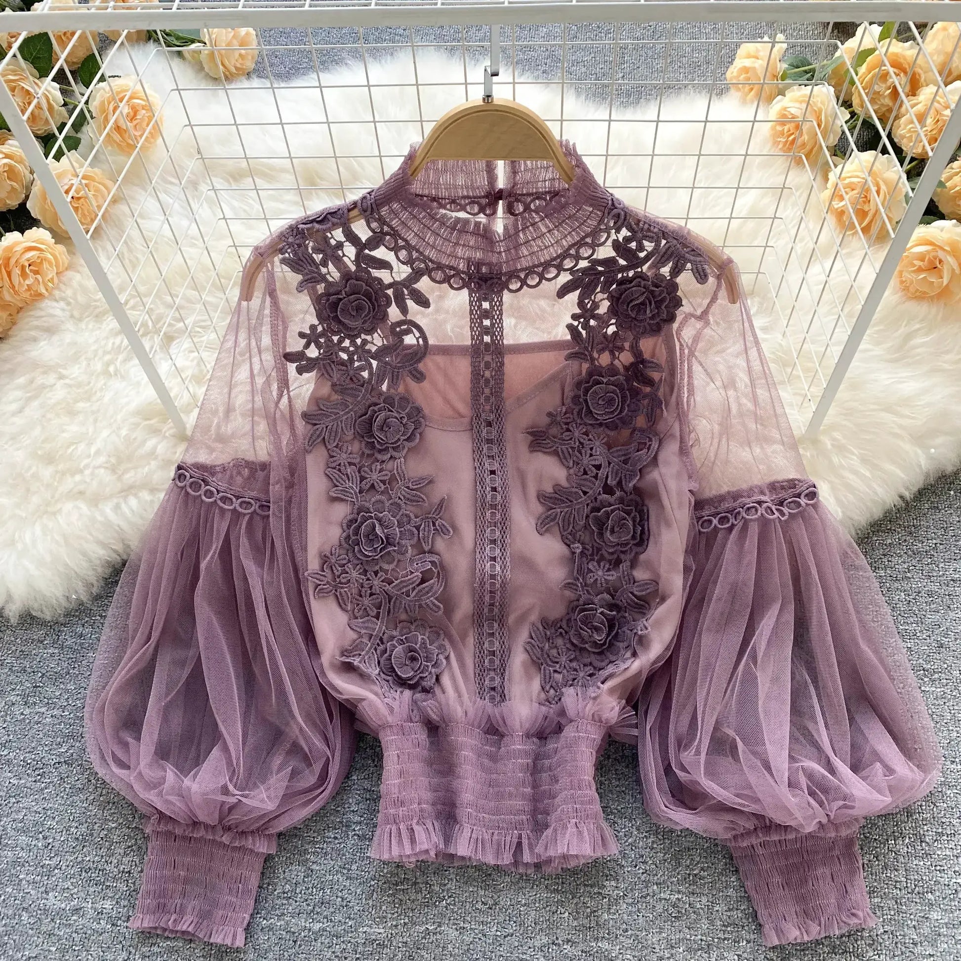 Lace puff long sleeve lavender blouse with floral appliqués and sheer lace details on hanger