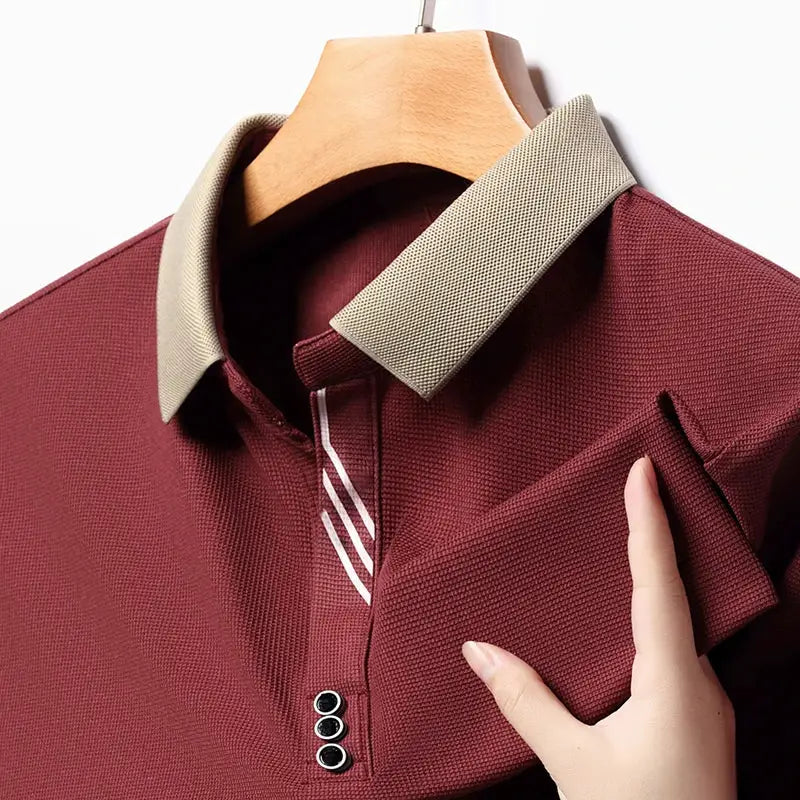 Men's polo shirt maroon with beige collar, textured knit fabric, short sleeves.