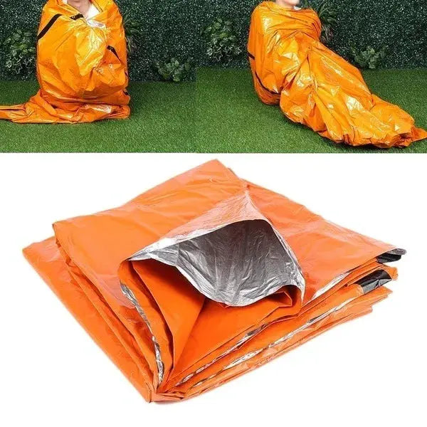 Portable orange waterproof emergency survival sleeping bag with reflective Mylar interior