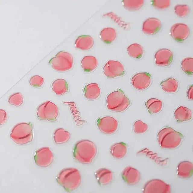 Pink translucent peach jelly texture nail art stickers on clear sheet with 3D peach shapes