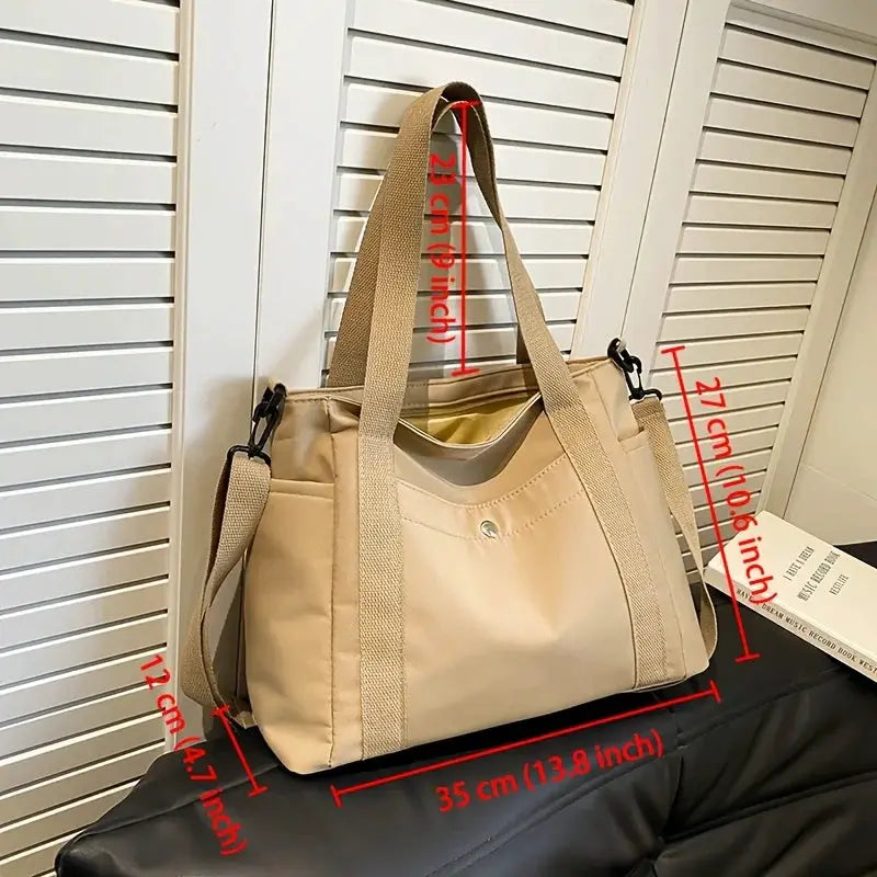 Large-capacity nylon crossbody bag by Simples Market in beige with removable strap