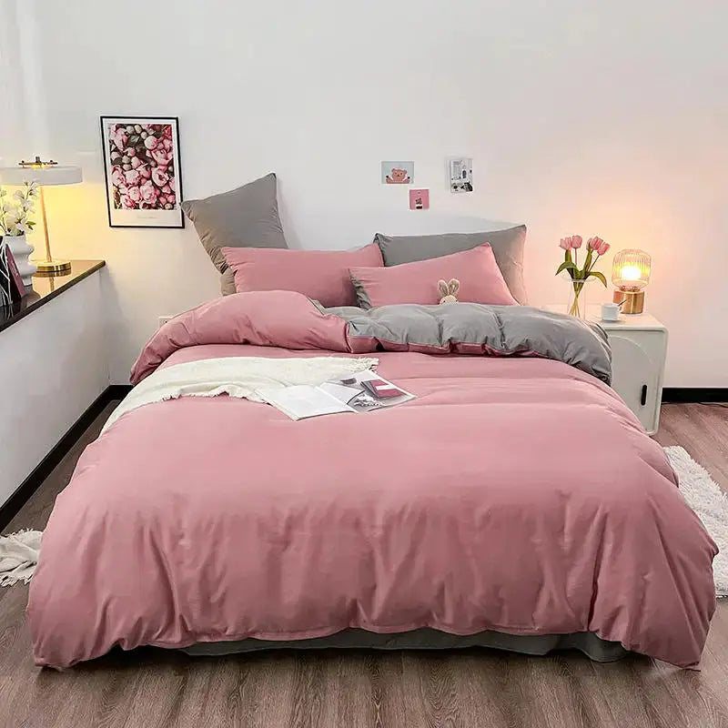 Pink duvet cover with gray reverse on a queen/king size bed
