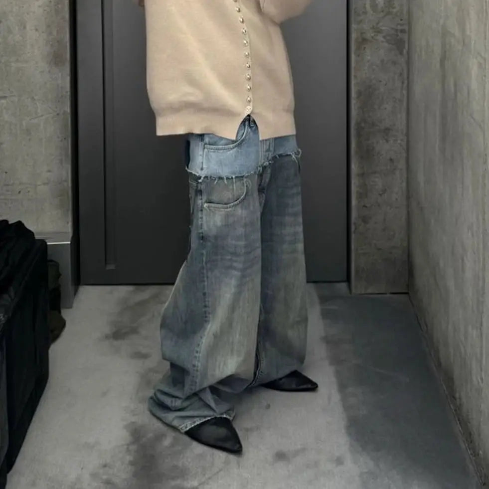 Baggy patchwork denim jeans with double-layer waist panels in light-wash, oversized straight fit.