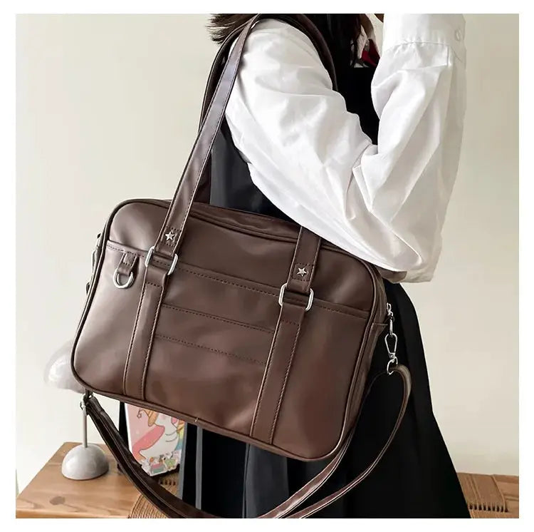 JK-style brown PU leather shoulder bag with dual top handles and detachable crossbody strap