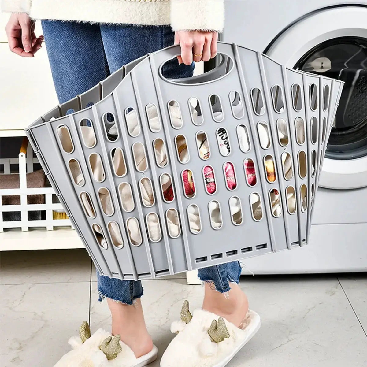 Gray foldable laundry hamper basket with handle, portable and collapsible for space-saving laundry room.