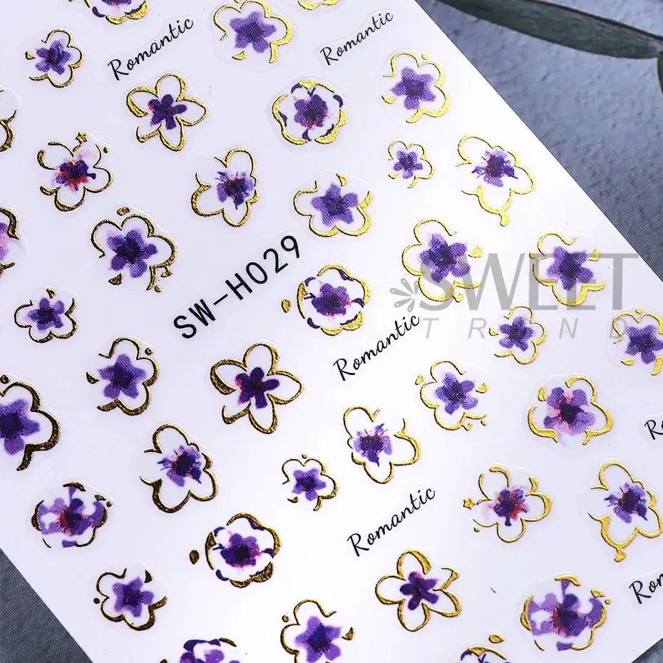 Nail stickers: golden pink hibiscus flowers with bronze-gold borders; 3D Sakura line decals for DIY manicure