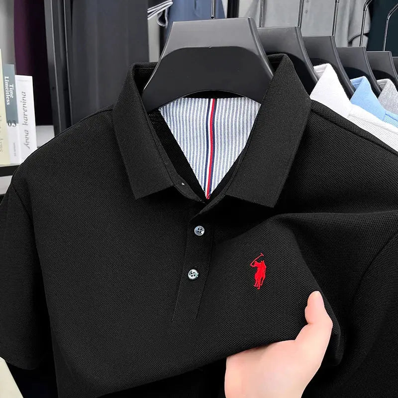 Black cotton polo shirt with red pony embroidery, short sleeves, striped inner collar.