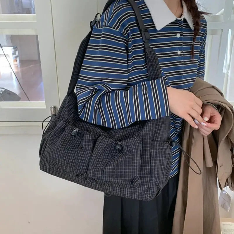 Korean nylon plaid shoulder bag with multiple front pockets and drawstring accents