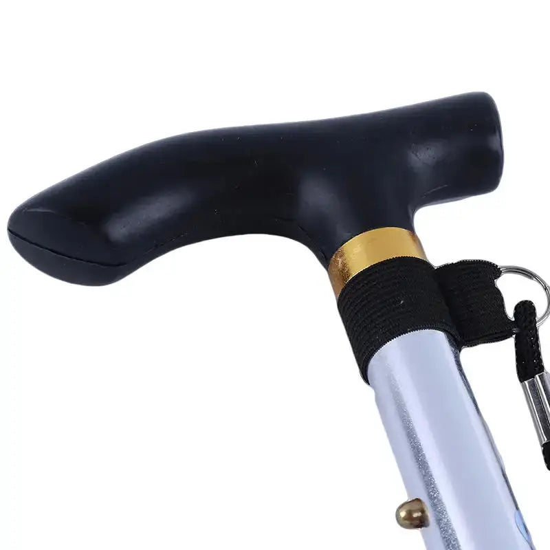 Telescopic walking stick with black ergonomic handle, gold collar and silver aluminum shaft.
