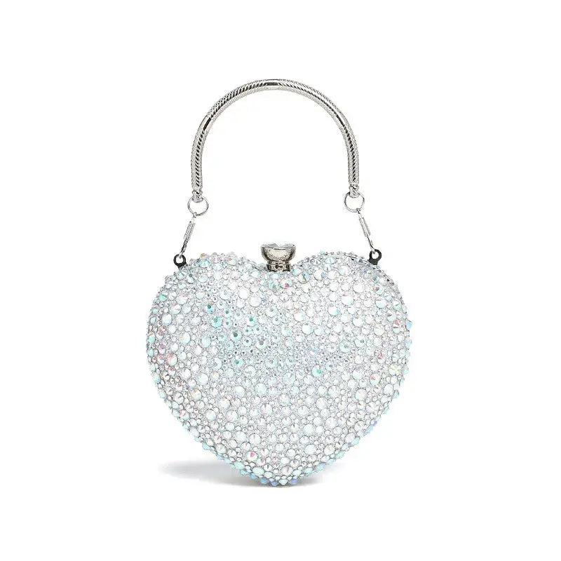Heart-shaped crystal clutch purse with diamond-inlay rhinestones and a silver-tone handle