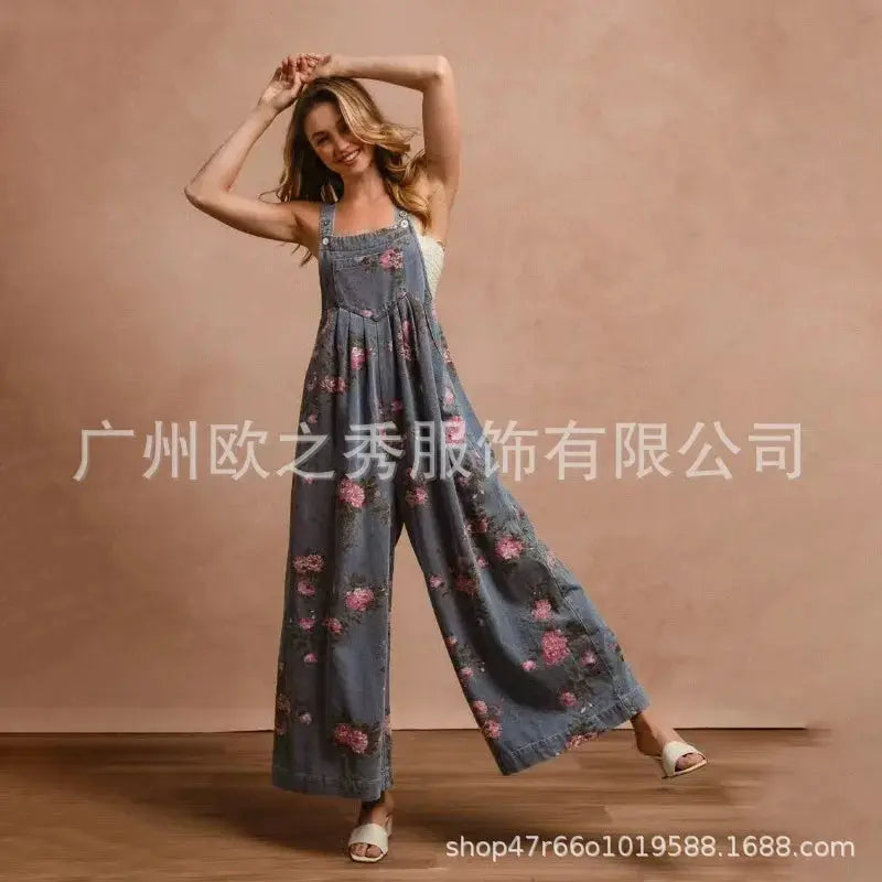 Denim floral print sleeveless jumpsuit for women, blue denim, wide-leg overalls with pockets.